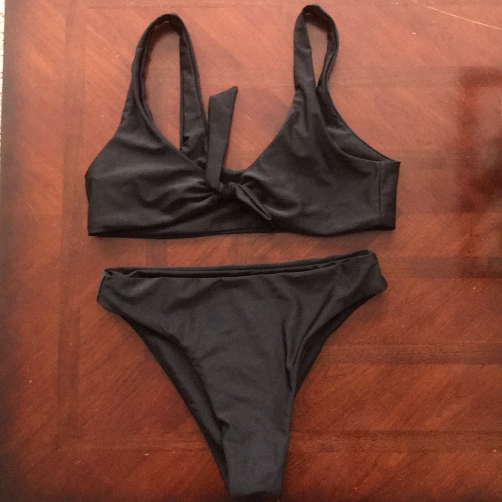 Black swim suit. Size medium. Never worn.